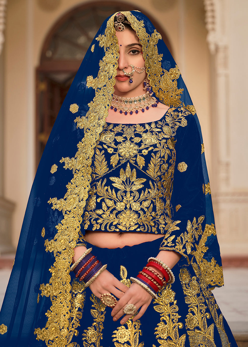 Buy Now Blue & Gold Embroidered Velvet Wedding Lehenga Choli Online in USA, UK, France, UAE & Worldwide at Empress Clothing