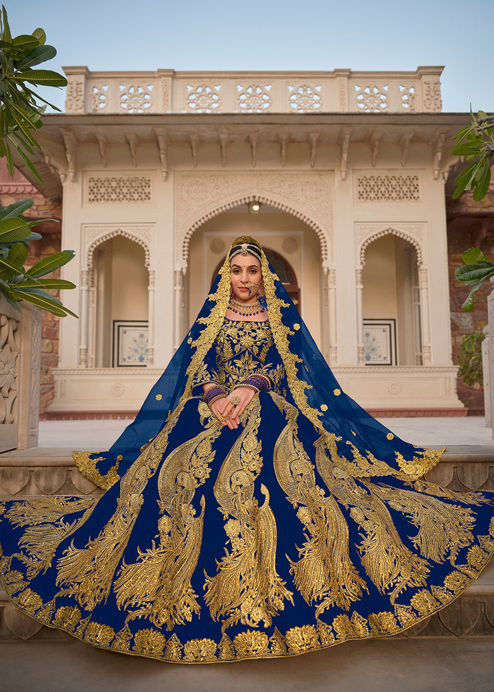 Buy Now Blue & Gold Embroidered Velvet Wedding Lehenga Choli Online in USA, UK, France, UAE & Worldwide at Empress Clothing