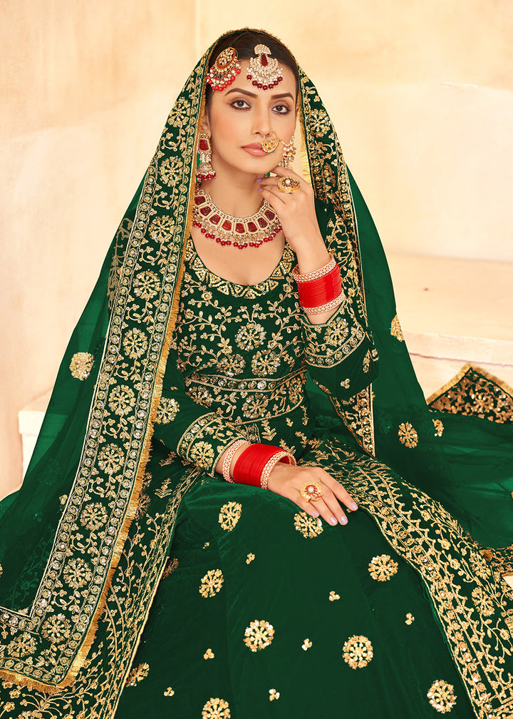 Buy Now Tempting Green Anarkali Style Velvet Wedding Lehenga Choli Online in USA, UK, Canada, France, Italy, Germany, UAE & Worldwide at Empress Clothing.