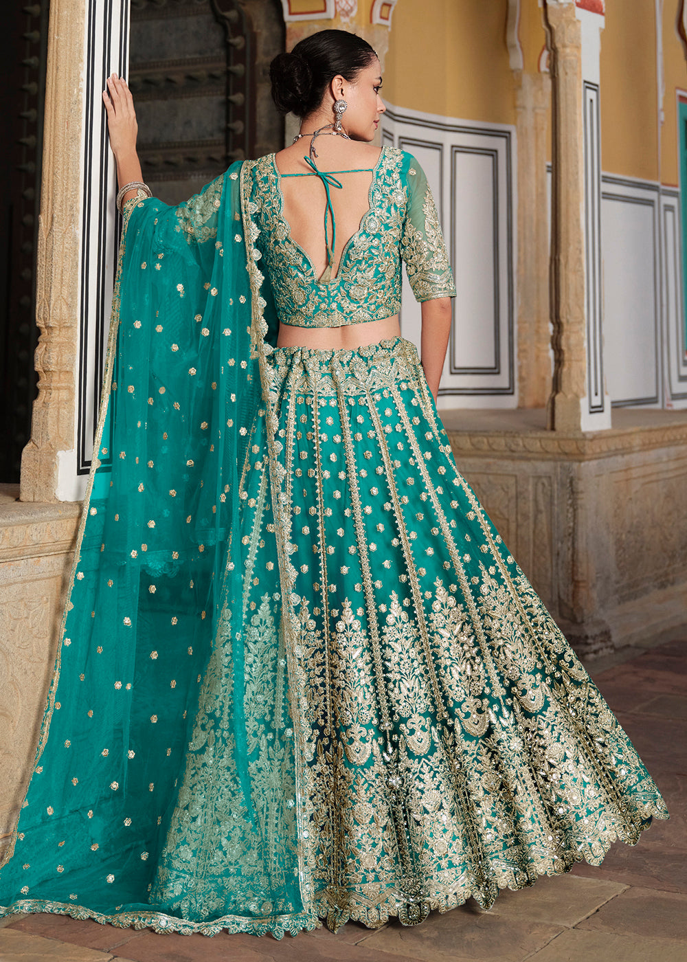 Designer Rama Net Embroidered Wedding Lehenga Choli