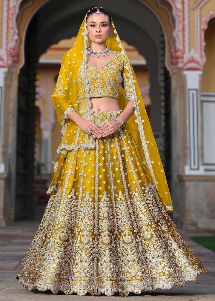 Buy Now Designer Yellow Net Embroidered Wedding Lehenga Choli Online in USA, UK, Canada, France & Worldwide at Empress Clothing.