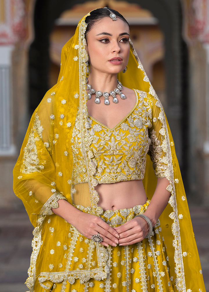 Buy Now Designer Yellow Net Embroidered Wedding Lehenga Choli Online in USA, UK, Canada, France & Worldwide at Empress Clothing.