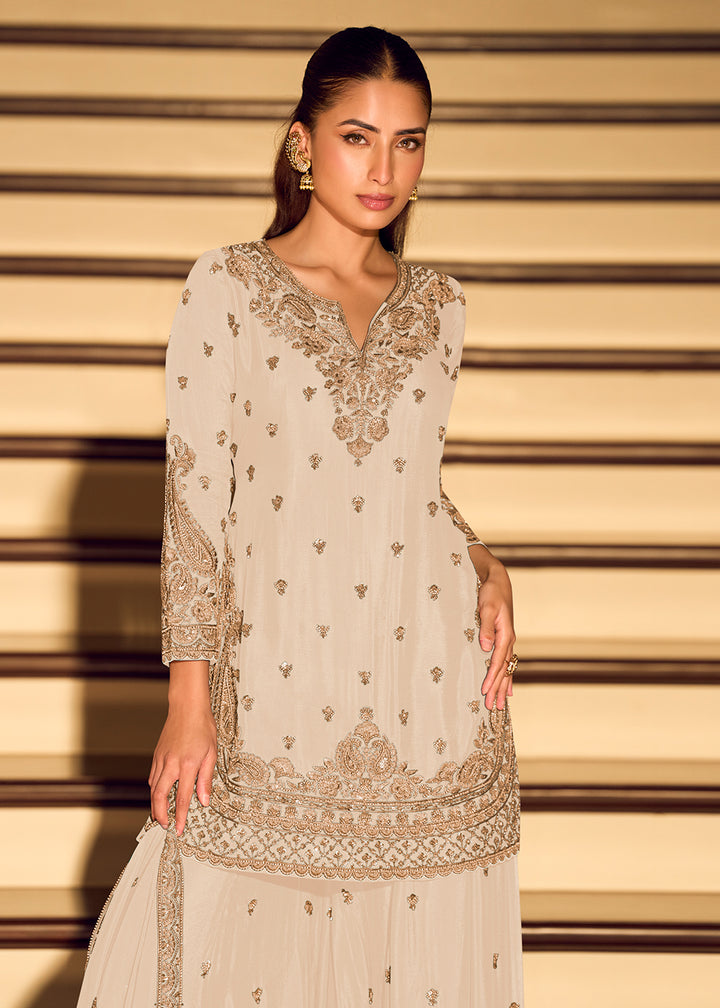 Shop Now Gold Embroidered Off White Eid Style Sharara Suit Online at Empress in US, UK, Canada, Germany, Australia, Sweden, Denmark, Qatar, Africa & Worldwide.