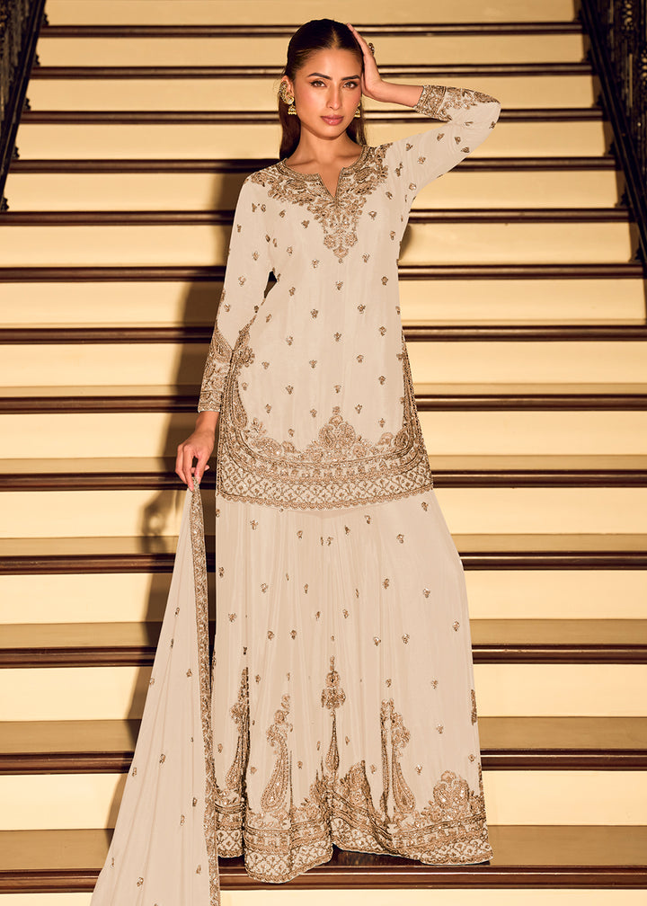 Shop Now Gold Embroidered Off White Eid Style Sharara Suit Online at Empress in US, UK, Canada, Germany, Australia, Sweden, Denmark, Qatar, Africa & Worldwide.
