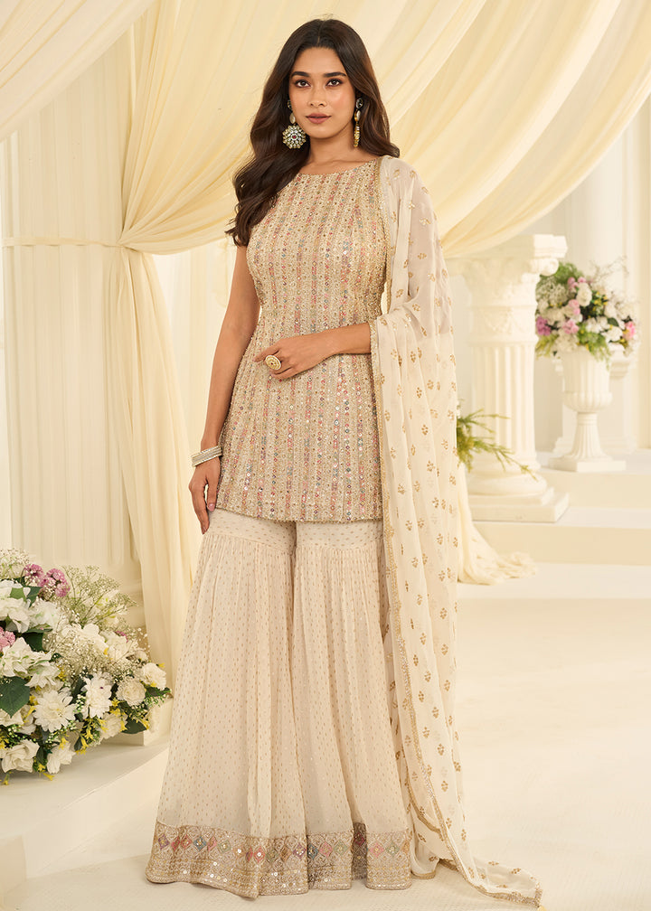 Shop Now Cream Premium Georgette Swarovski Zarkan Festive Gharara Suit Online at Empress in US, UK, Canada, Germany, Australia, Sweden, Denmark, UAE & Worldwide.