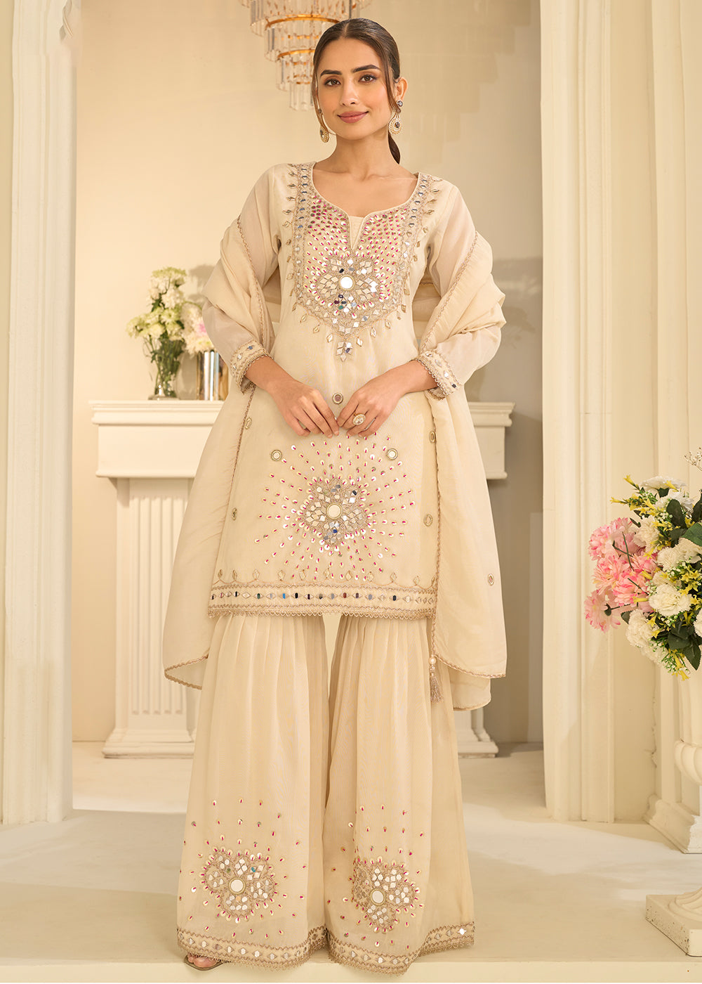 Shop Now Cream Mirror Work Shimmer Silk Festive Gharara Suit Online at Empress in USA, UK, Canada, Italy, Germany, France, Greece, Sweden, UAE & Worldwide.