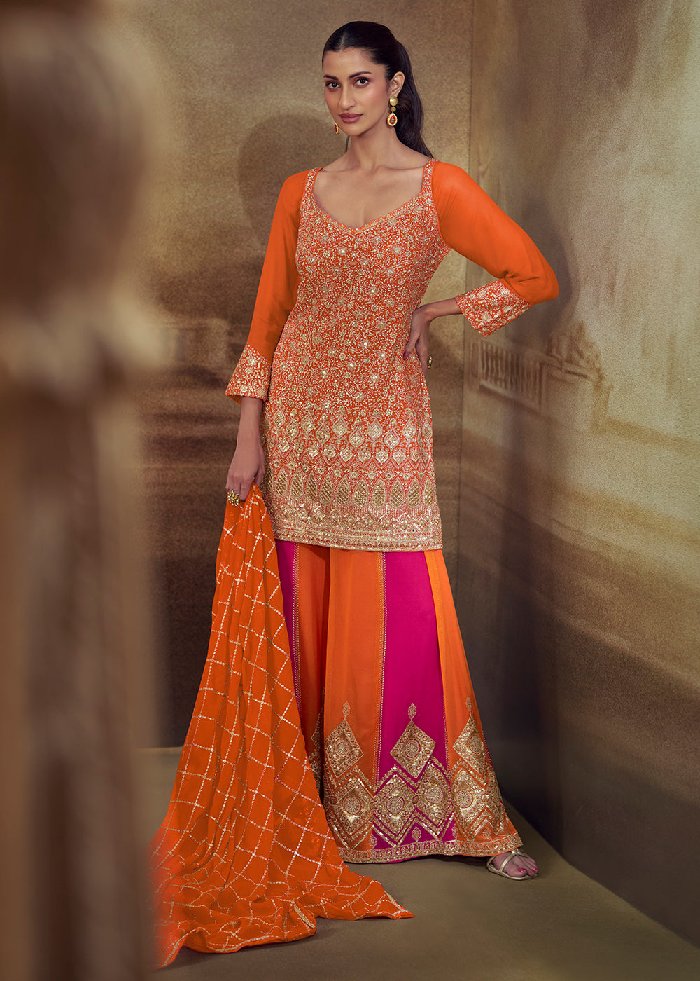 Shop Now Orange & Pink Zarkan Zari Embroidery Gharara Style Suit Online at Empress in US, UK, Canada, Italy, Germany, France, Greece, Sweden, UAE & Worldwide.
