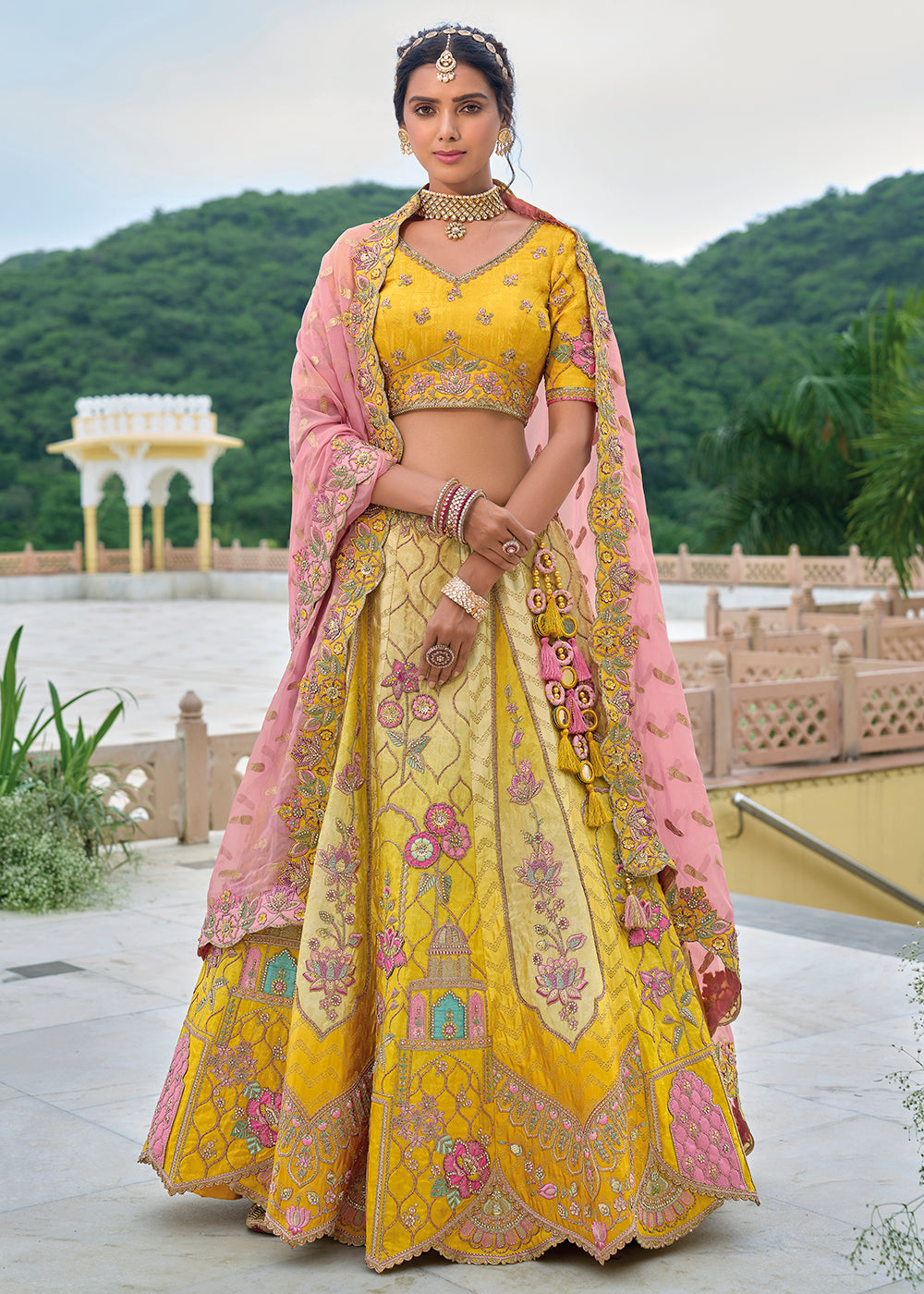 Buy Now Yellow & Pink Heavy Embroidered Bridal Style Lehenga Choli Online in USA, UK, Canada, France & Worldwide at Empress Clothing. 