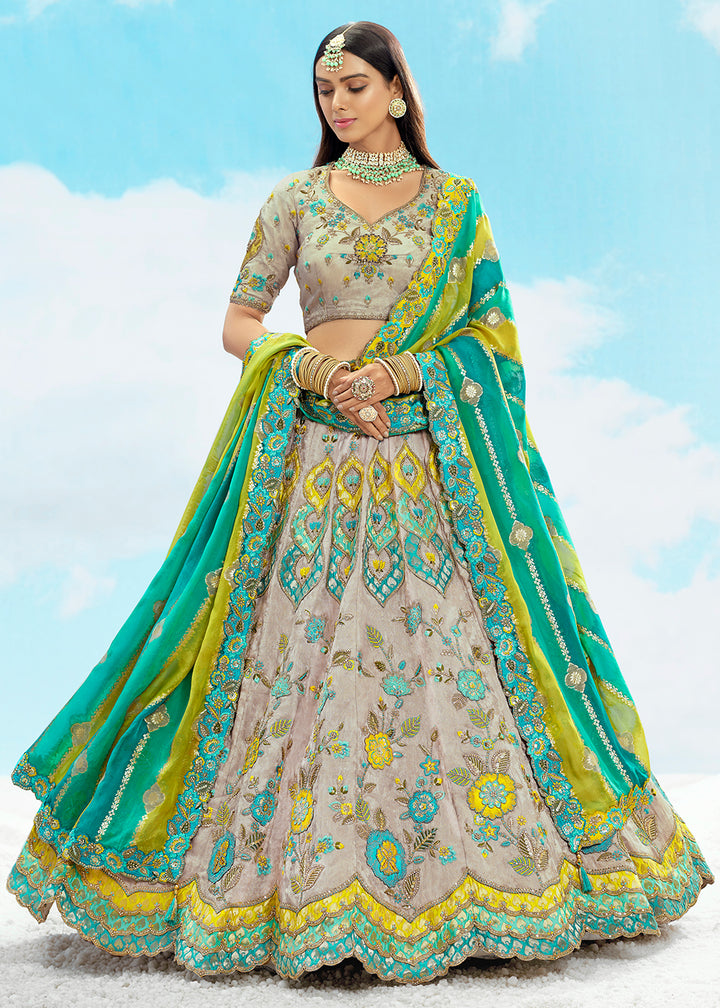 Buy Now Ash Grey Fancy Silk Heavy Embroidered Bridal Lehenga Choli Online in USA, UK, Canada, France, Italy, Germany, Austria, UAE & Worldwide at Empress.