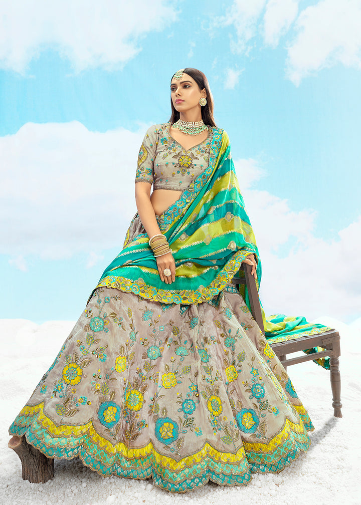 Buy Now Ash Grey Fancy Silk Heavy Embroidered Bridal Lehenga Choli Online in USA, UK, Canada, France, Italy, Germany, Austria, UAE & Worldwide at Empress.