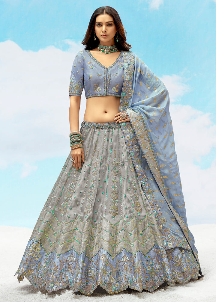 Buy Now Silver Grey Fancy Silk Heavy Embroidered Bridal Lehenga Choli Online in USA, UK, Canada, France, Italy, Germany, Austria, UAE & Worldwide at Empress.