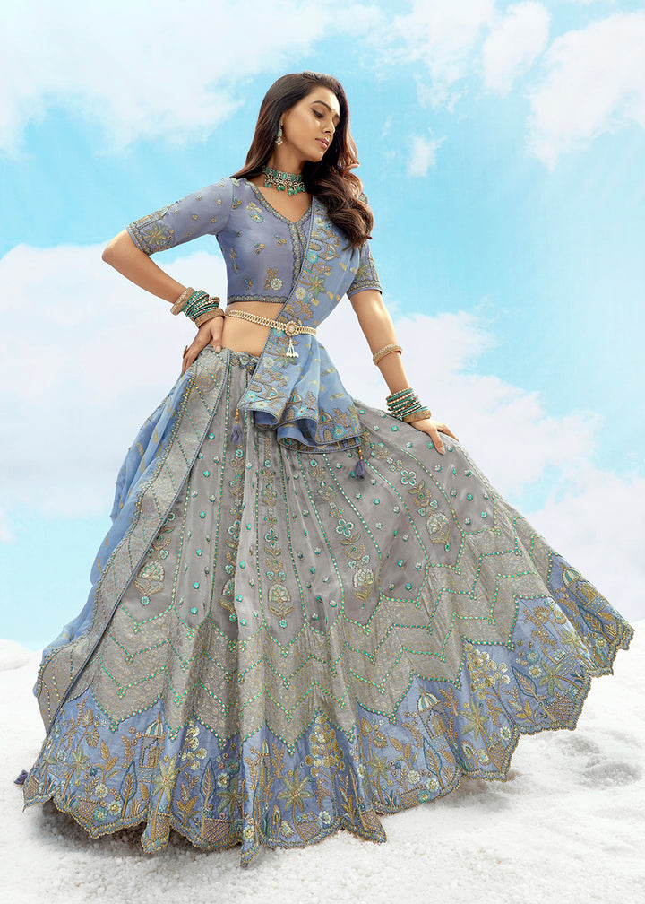 Buy Now Silver Grey Fancy Silk Heavy Embroidered Bridal Lehenga Choli Online in USA, UK, Canada, France, Italy, Germany, Austria, UAE & Worldwide at Empress.
