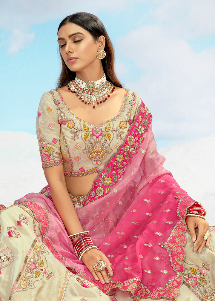 Buy Now Creamy Fancy Silk Heavy Embroidered Bridal Lehenga Choli Online in USA, UK, Canada, France, Italy, Germany, Austria, UAE & Worldwide at Empress.