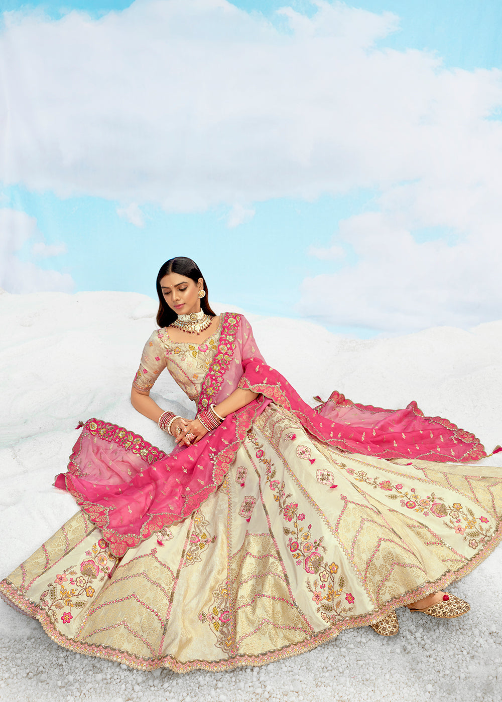 Buy Now Creamy Fancy Silk Heavy Embroidered Bridal Lehenga Choli Online in USA, UK, Canada, France, Italy, Germany, Austria, UAE & Worldwide at Empress.