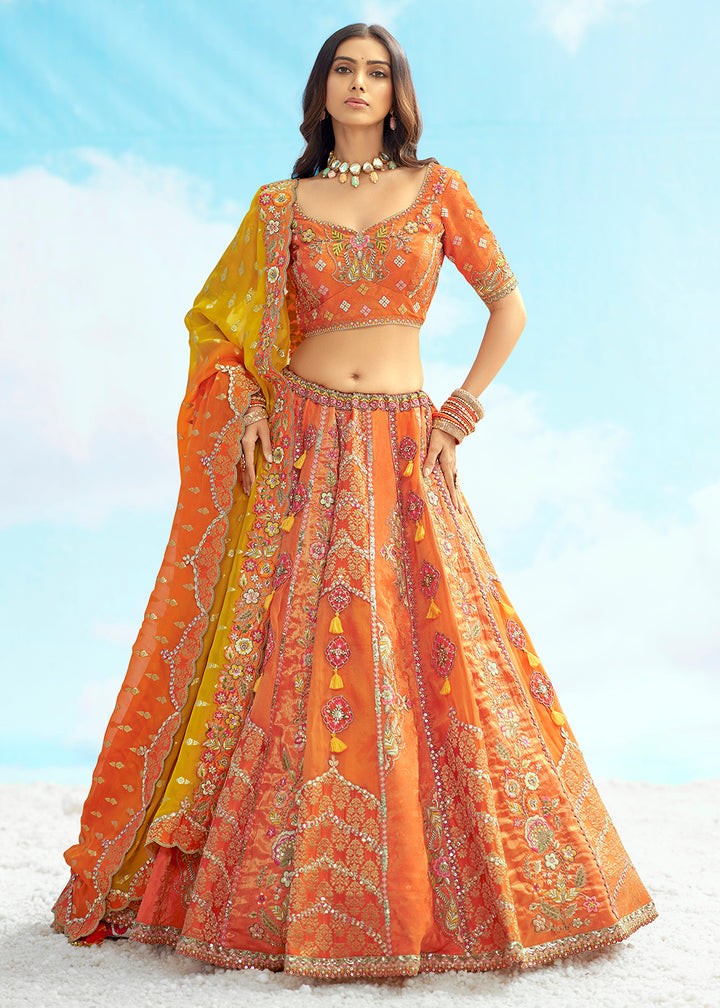 Buy Now Orange Fancy Silk Heavy Embroidered Bridal Lehenga Choli Online in USA, UK, Canada, France, Italy, Germany, Austria, UAE & Worldwide at Empress.