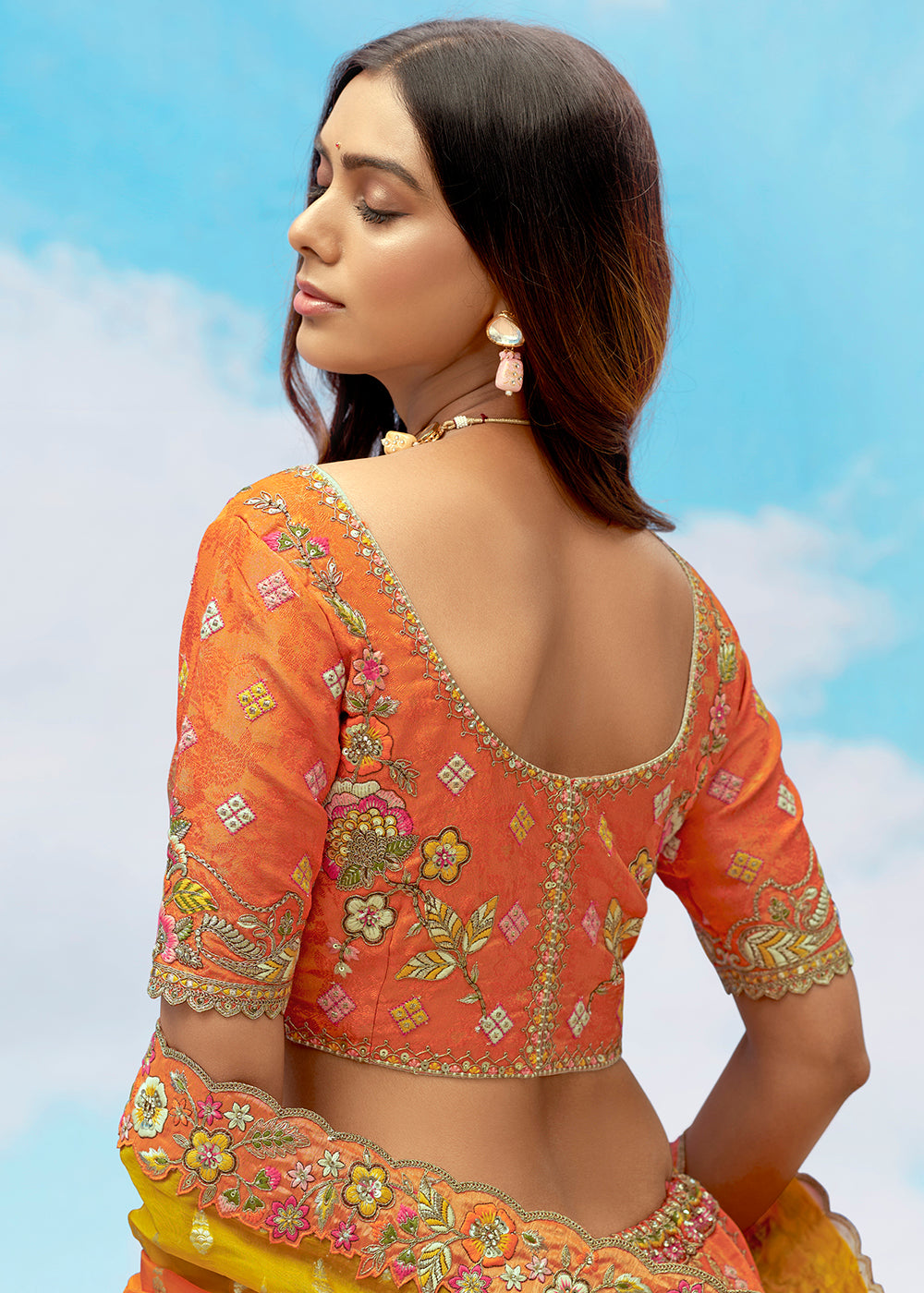 Buy Now Orange Fancy Silk Heavy Embroidered Bridal Lehenga Choli Online in USA, UK, Canada, France, Italy, Germany, Austria, UAE & Worldwide at Empress.