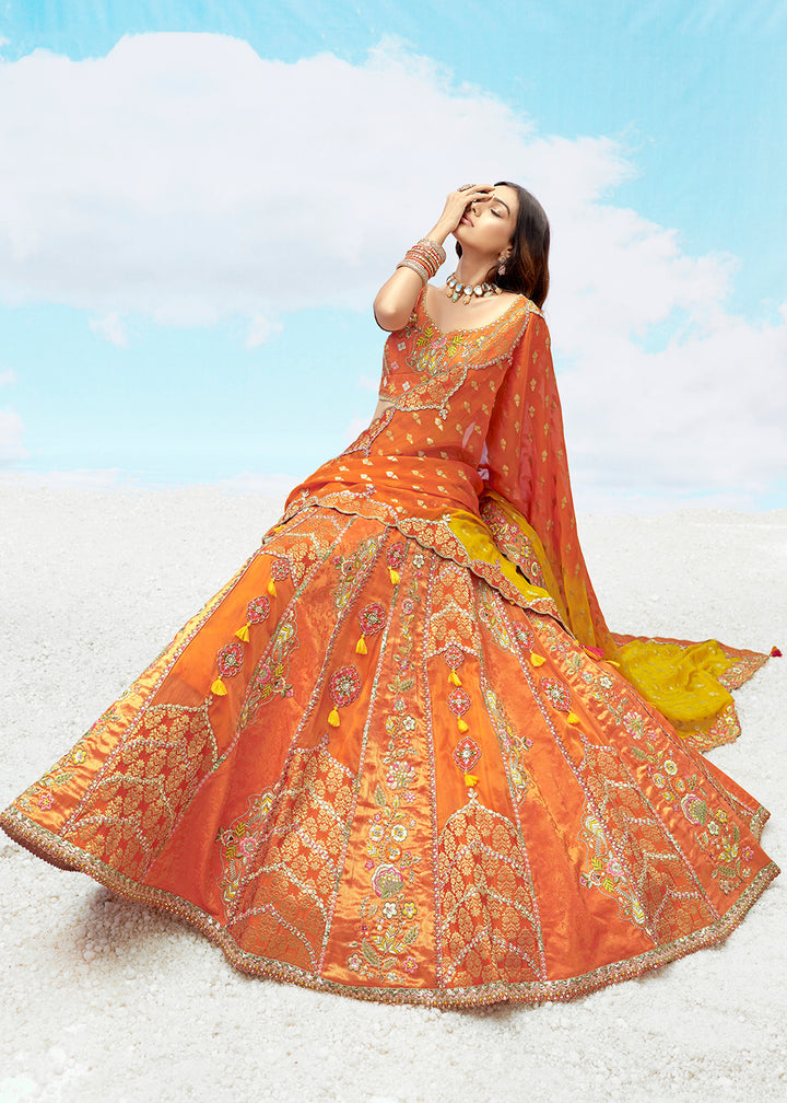 Buy Now Orange Fancy Silk Heavy Embroidered Bridal Lehenga Choli Online in USA, UK, Canada, France, Italy, Germany, Austria, UAE & Worldwide at Empress.