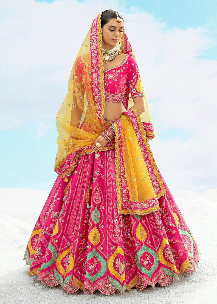 Buy Now Rani Pink Fancy Silk Heavy Embroidered Bridal Lehenga Choli Online in USA, UK, Canada, France, Italy, Germany, Austria, UAE & Worldwide at Empress.