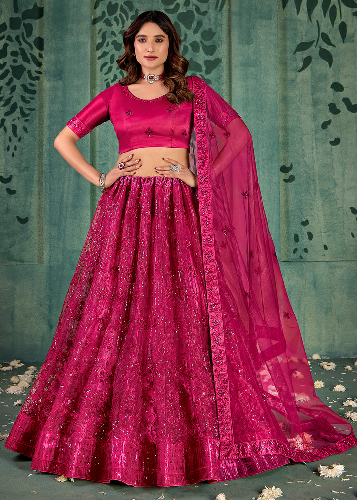 Buy Now Magenta Pink Sequins Embroidred Net Lehenga Choli Online in USA, UK, Canada, Italy, France & Worldwide at Empress Clothing.