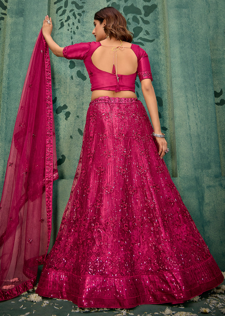 Buy Now Magenta Pink Sequins Embroidred Net Lehenga Choli Online in USA, UK, Canada, Italy, France & Worldwide at Empress Clothing.