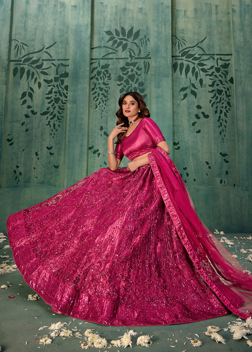 Buy Now Magenta Pink Sequins Embroidred Net Lehenga Choli Online in USA, UK, Canada, Italy, France & Worldwide at Empress Clothing.