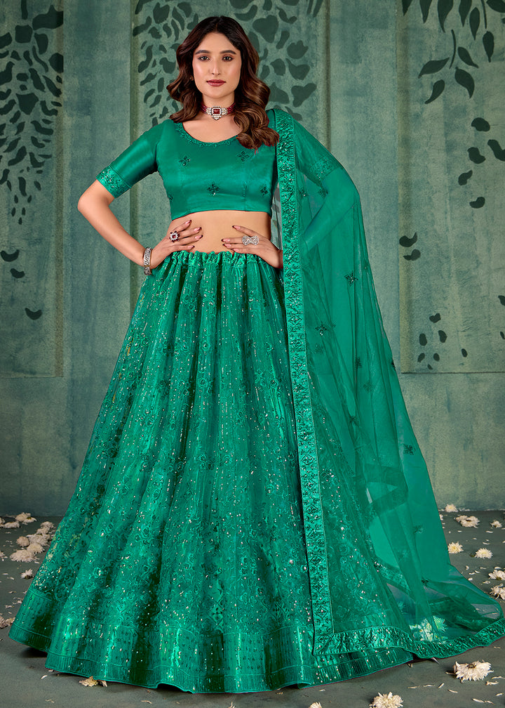 Buy Now Persian Green Sequins Embroidred Net Lehenga Choli Online in USA, UK, Canada, Italy, France & Worldwide at Empress Clothing.