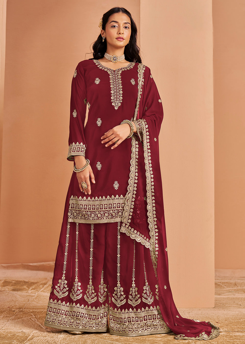 maroon and gold indian dress Maroon Embellished Anarkali Gown With Rich Gold Embroidery, Full Sleeves and Flowing Flare, Perfect for Bridal Events and Formal Occasions