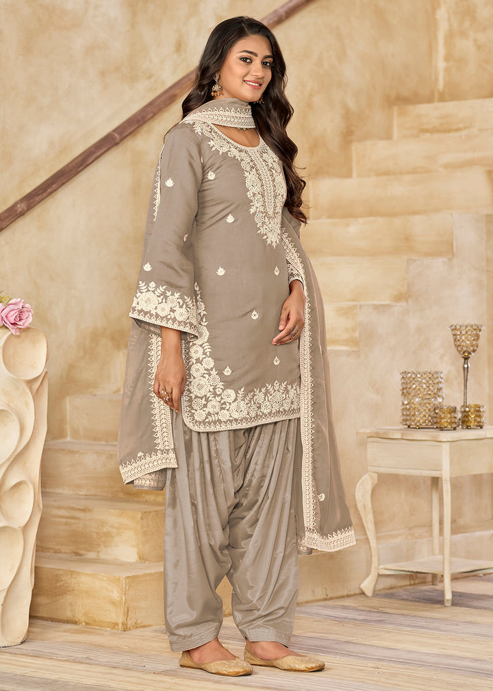 Buy Now Grey Roman Silk Embroidered Punjabi Patiala Suit Online in USA, UK, Canada, Germany, Italy, France, Denmark, UAE & Worldwide at Empress Clothing.