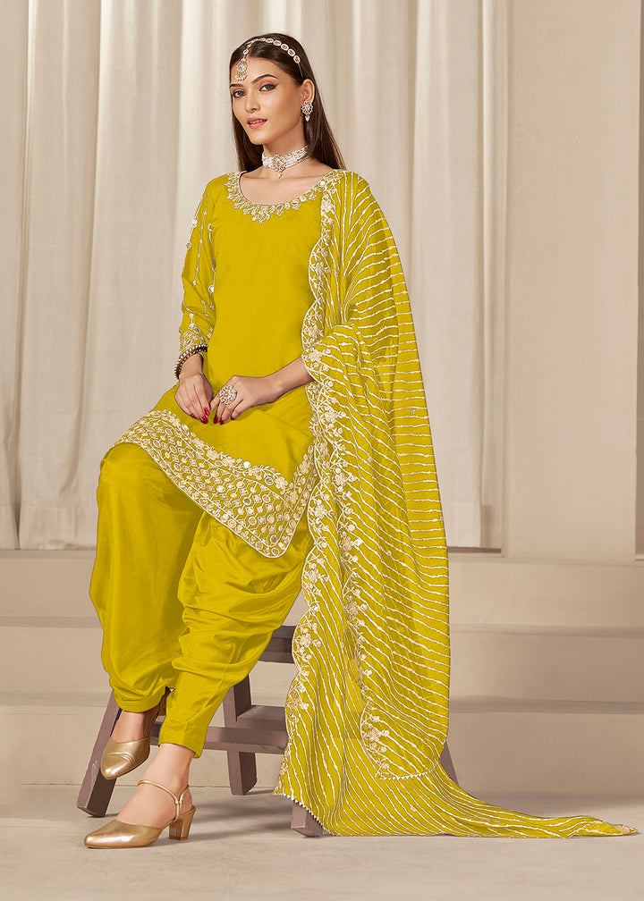 Buy Now Yellow Silk Embroidered Patiala Punjabi Suit Online in USA, UK, Canada, Germany, Italy, France, Denmark, Austria, UAE & Worldwide at Empress Clothing.