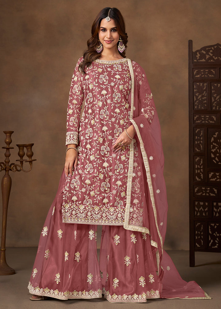 Shop Now Net Pink Wedding Embroidered Gharara Style Suit Online at Empress in USA, UK, Canada, Germany, Australia, Sweden, Denmark, UAE, Qatar & Worldwide.