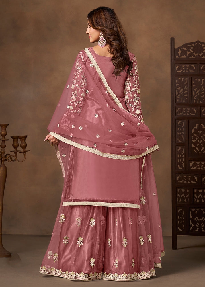 Shop Now Net Pink Wedding Embroidered Gharara Style Suit Online at Empress in USA, UK, Canada, Germany, Australia, Sweden, Denmark, UAE, Qatar & Worldwide.