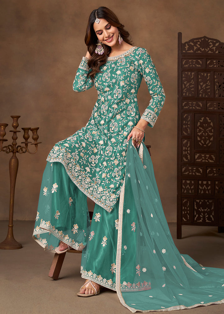 Shop Now Net Green Wedding Embroidered Gharara Style Suit Online at Empress in USA, UK, Canada, Germany, Australia, Sweden, Denmark, UAE, Qatar & Worldwide.