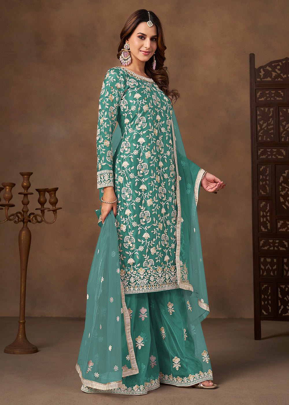 Shop Now Net Green Wedding Embroidered Gharara Style Suit Online at Empress in USA, UK, Canada, Germany, Australia, Sweden, Denmark, UAE, Qatar & Worldwide.