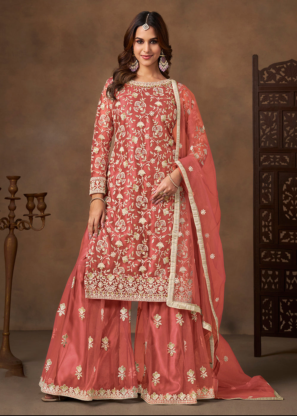 Shop Now Net Peach Wedding Embroidered Gharara Style Suit Online at Empress in USA, UK, Canada, Germany, Australia, Sweden, Denmark, UAE, Qatar & Worldwide.