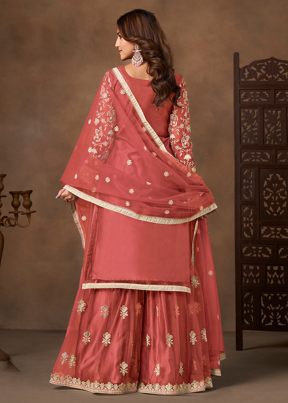 Shop Now Net Peach Wedding Embroidered Gharara Style Suit Online at Empress in USA, UK, Canada, Germany, Australia, Sweden, Denmark, UAE, Qatar & Worldwide.