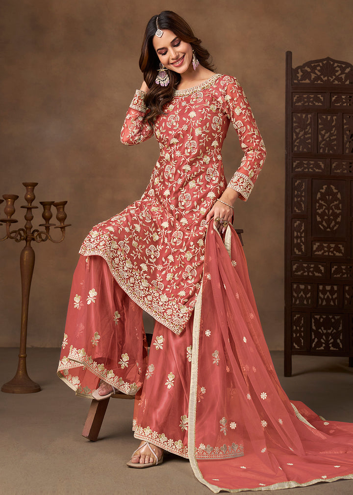 Shop Now Net Peach Wedding Embroidered Gharara Style Suit Online at Empress in USA, UK, Canada, Germany, Australia, Sweden, Denmark, UAE, Qatar & Worldwide.