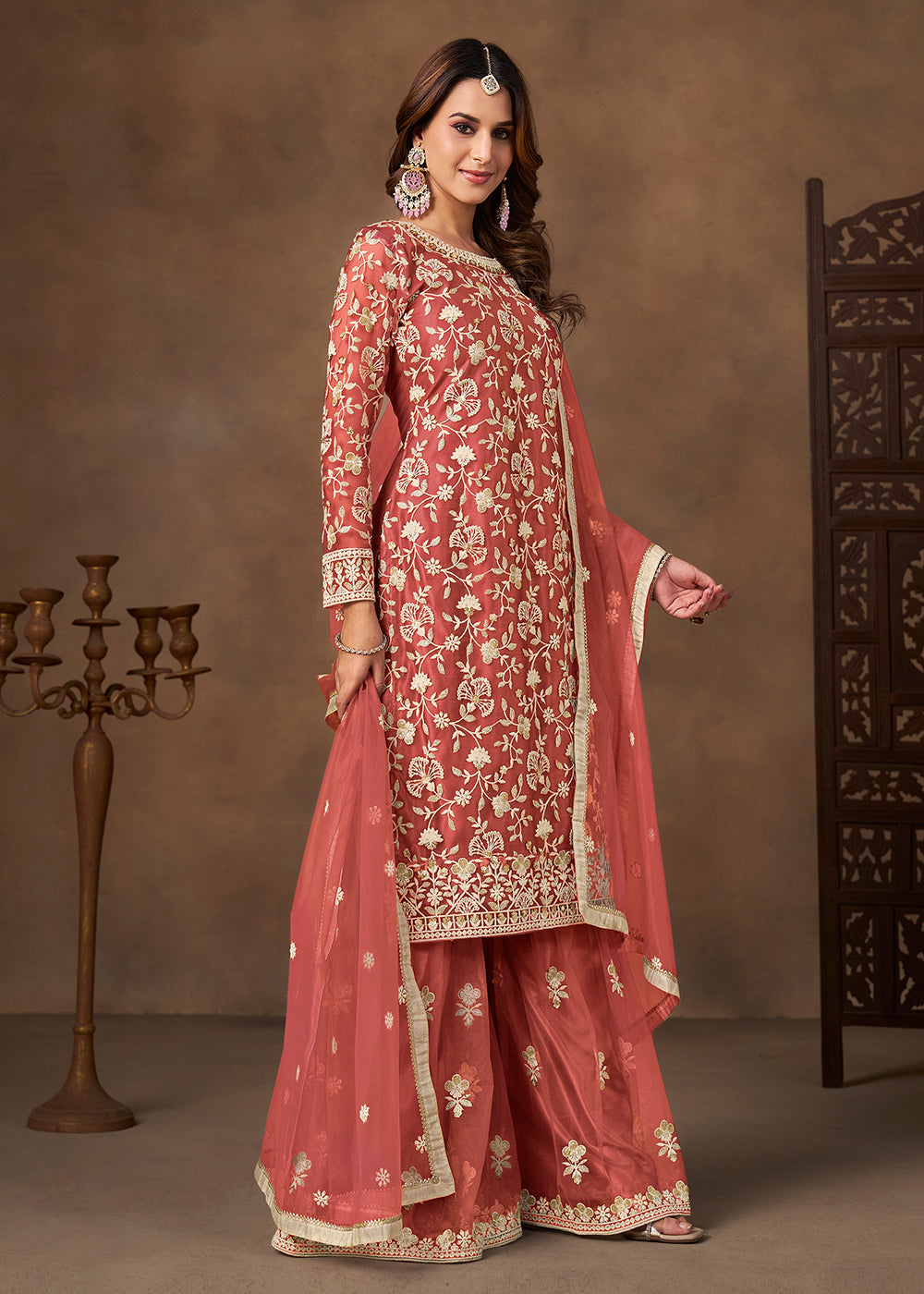 Shop Now Net Peach Wedding Embroidered Gharara Style Suit Online at Empress in USA, UK, Canada, Germany, Australia, Sweden, Denmark, UAE, Qatar & Worldwide.