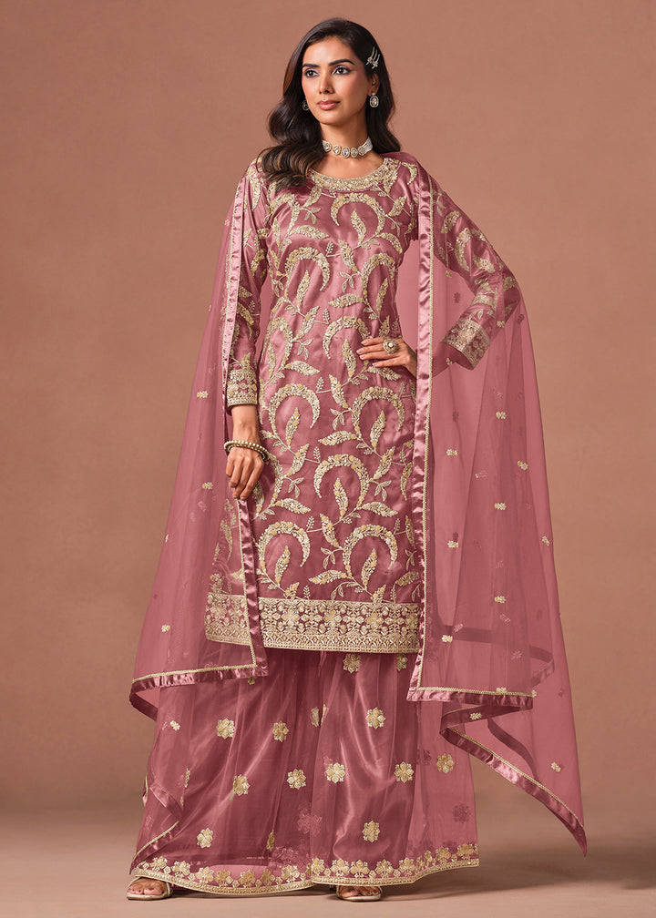 Shop Now Pink Net Beautifully Embroidered Wedding Party Sharara Suit Online at Empress in US, UK, Canada, Italy, Germany, France, Greece, Sweden, UAE, Denmark &amp; Worldwide.