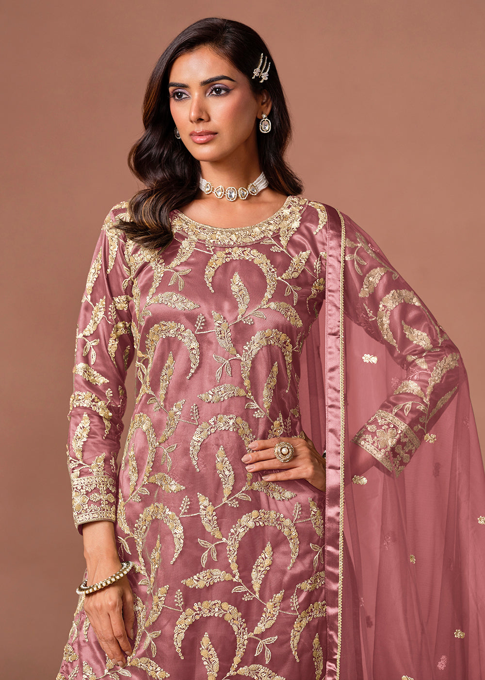 Shop Now Pink Net Beautifully Embroidered Wedding Party Sharara Suit Online at Empress in US, UK, Canada, Italy, Germany, France, Greece, Sweden, UAE, Denmark & Worldwide.
