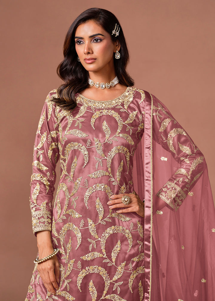 Shop Now Pink Net Beautifully Embroidered Wedding Party Sharara Suit Online at Empress in US, UK, Canada, Italy, Germany, France, Greece, Sweden, UAE, Denmark &amp; Worldwide.