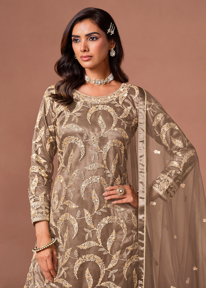 Shop Now Brown Net Beautifully Embroidered Wedding Party Sharara Suit Online at Empress in US, UK, Canada, Italy, Germany, France, Greece, Sweden, Denmark &amp; Worldwide.