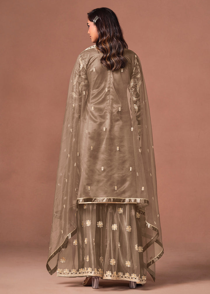 Shop Now Brown Net Beautifully Embroidered Wedding Party Sharara Suit Online at Empress in US, UK, Canada, Italy, Germany, France, Greece, Sweden, Denmark &amp; Worldwide.