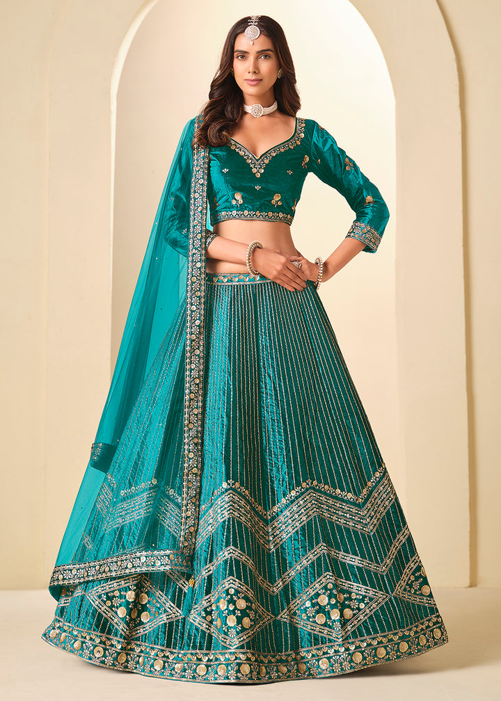 Buy Now Firozi Velvet Beutifully Embroidered Lehenga Choli Online in US, UK, Canada, France, Germany, Sweden, Greece, Denmark, Spain, UAE & Worldwide at Empress