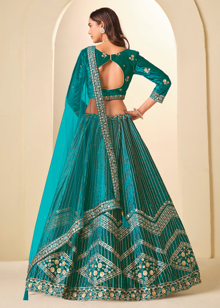 Buy Now Firozi Velvet Beutifully Embroidered Lehenga Choli Online in US, UK, Canada, France, Germany, Sweden, Greece, Denmark, Spain, UAE & Worldwide at Empress