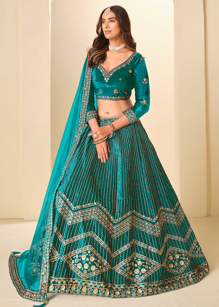 Buy Now Firozi Velvet Beutifully Embroidered Lehenga Choli Online in US, UK, Canada, France, Germany, Sweden, Greece, Denmark, Spain, UAE & Worldwide at Empress