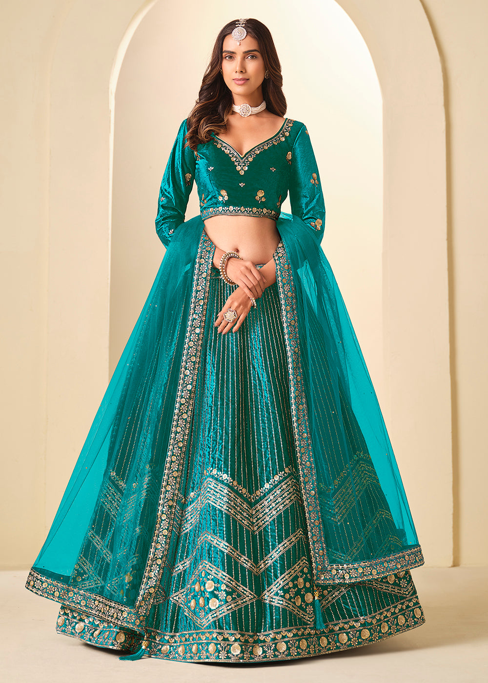 Buy Now Firozi Velvet Beutifully Embroidered Lehenga Choli Online in US, UK, Canada, France, Germany, Sweden, Greece, Denmark, Spain, UAE & Worldwide at Empress