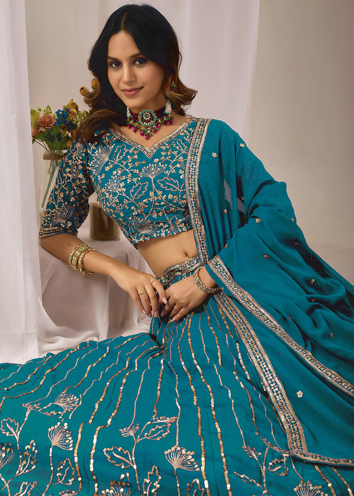 Buy Now Turquoise Faux Georgette Designer Style Lehenga Choli Online in US, UK, Canada, France, Italy, Greece, Sweden, Netherlands, UAE &amp; Worldwide at Empress.