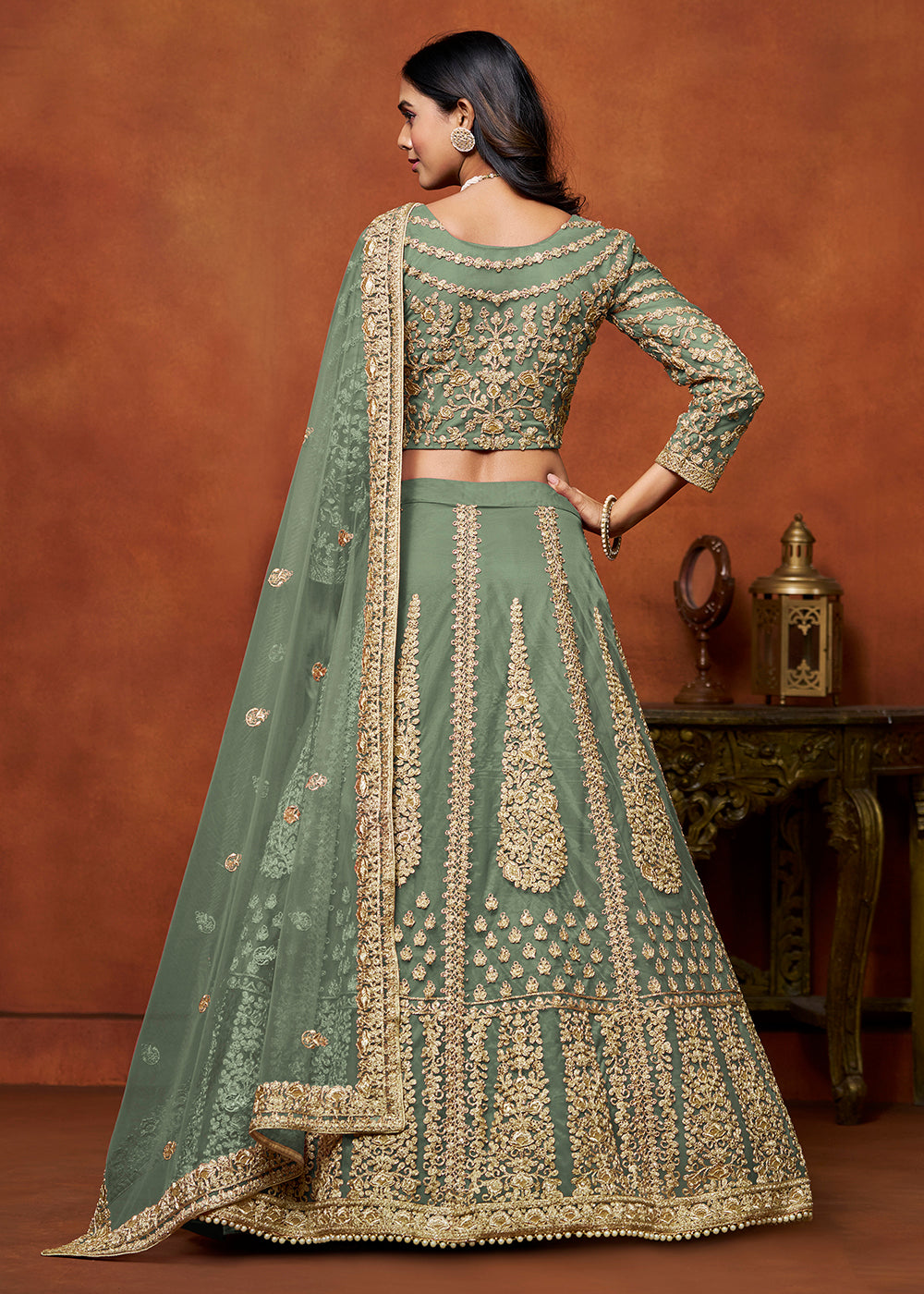 Buy Now Sage Green Net Embroidered Festive Lehenga Choli Online in USA, UK, Canada, UAE & Worldwide at Empress Clothing.