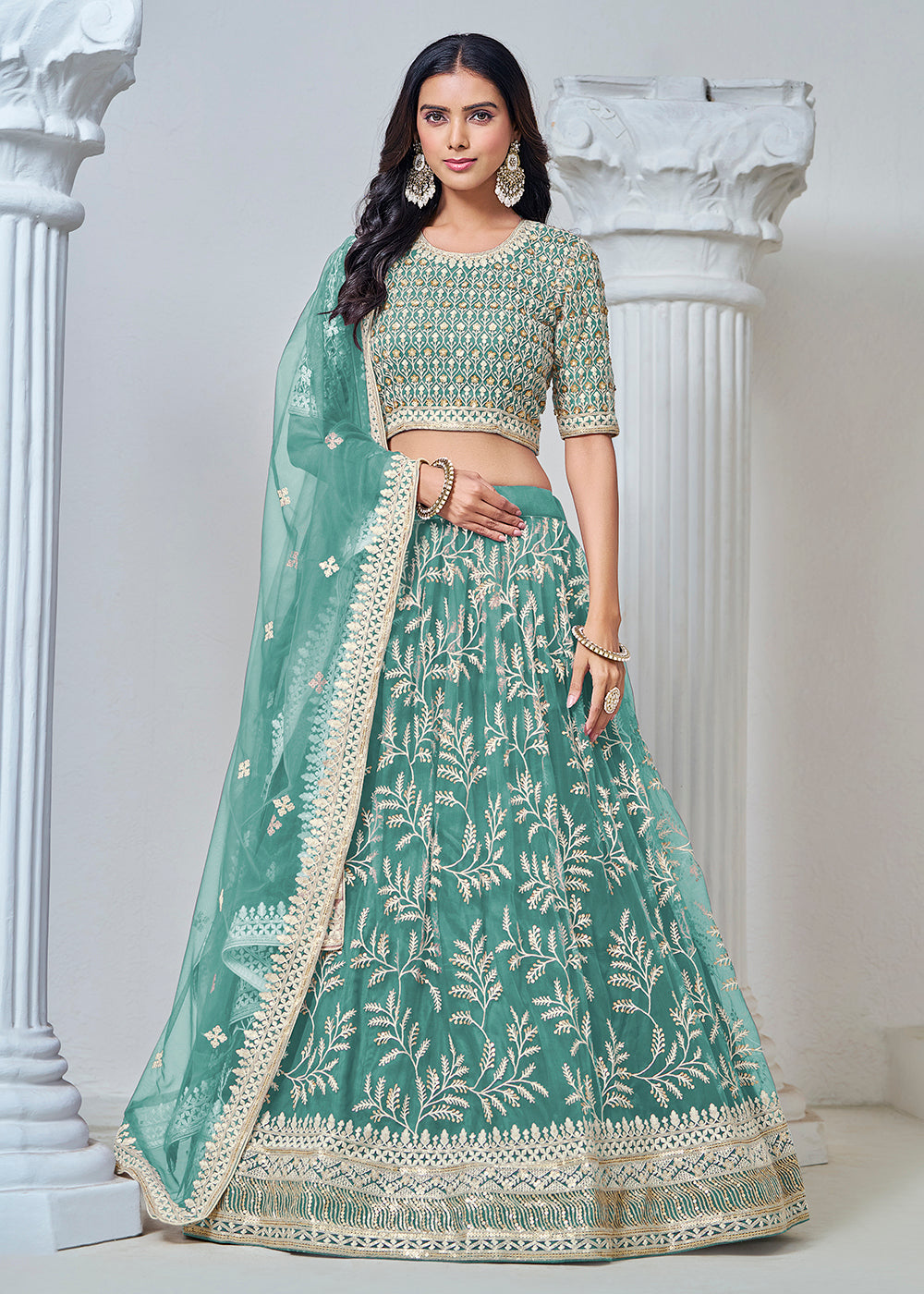 Buy Now Turquoise Net Embroidered Wedding Festive Lehenga Choli Online in USA, UK, Canada, UAE & Worldwide at Empress Clothing. 