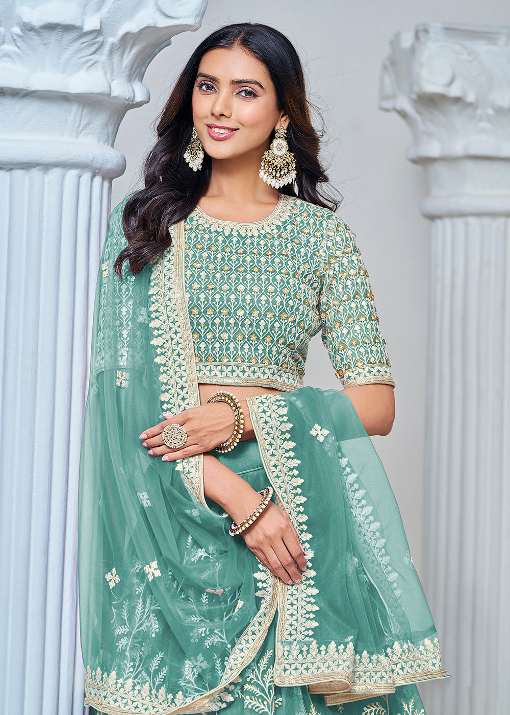 Buy Now Turquoise Net Embroidered Wedding Festive Lehenga Choli Online in USA, UK, Canada, Switzerland & Worldwide at Empress Clothing. 